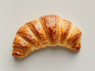 Freshly Baked Croissant on a Light Background for Breakfast Enjoyment