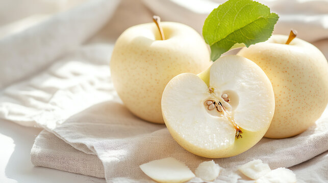 Fresh sliced yellow apples on a linen cloth, showcasing their juicy texture and vibrant color, perfect for healthy eating. - Powered by Adobe