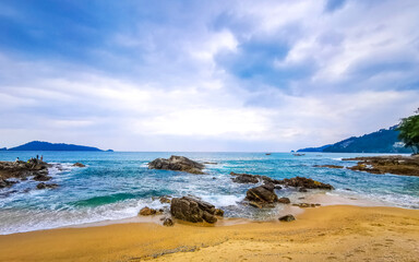 Kalim Beach tropical landscape panorama turquoise water waves Phuket Thailand.