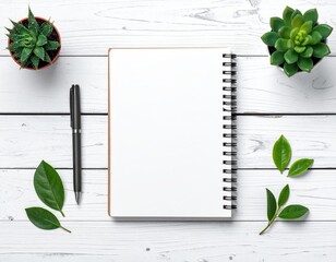 Blank notebook, pen, succulents on white wood table