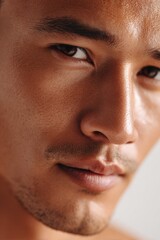 Obraz premium Sophisticated Close-Up Portrait of an East Asian Man with Fair Glowing Skin and Calm Confident Expression 