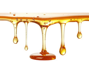 Golden liquid drips, amber, transparent, against black