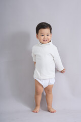 The child stands with a gentle expression.