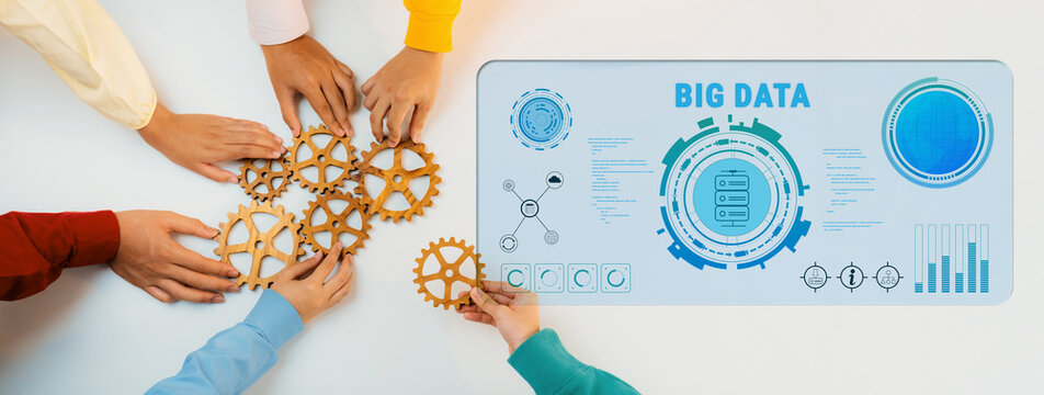 Hands gather wooden gears while a big data infographic presents analytics concepts on a table, showcasing teamwork and innovation in technology-driven projects. Trope