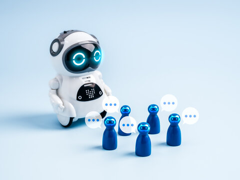 Cute AI robot interacting with chatbot avatars and speech bubbles, symbolizing AI agents, virtual assistants, robotics, and future innovation in artificial intelligence communication concept.