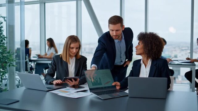 Business Team Analyzing Data in Modern Office