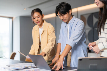 Crm software and customer management system team of asian business professionals analyzing data reports and marketing strategies, teamwork meeting improve sales service customer relationship at office