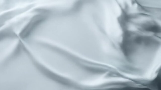 Abstract grayscale image featuring softly lit, flowing forms with delicate textures and shadows