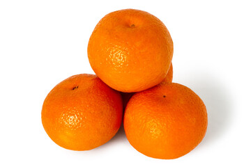 A pile of natural tangerines on a white background. Tangerines with shadows isolated