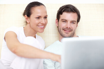 Happy, laptop and couple in bed in home for online shopping, internet and website in morning. Marriage, relax and man with woman on computer for research, connection and bonding in bedroom together