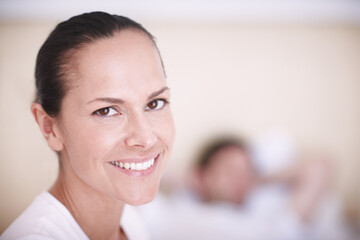 Portrait, woman and relax with smile in bedroom for lazy weekend, holiday break or peaceful...