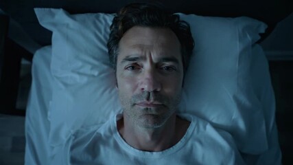 Sleepless Man in Bed