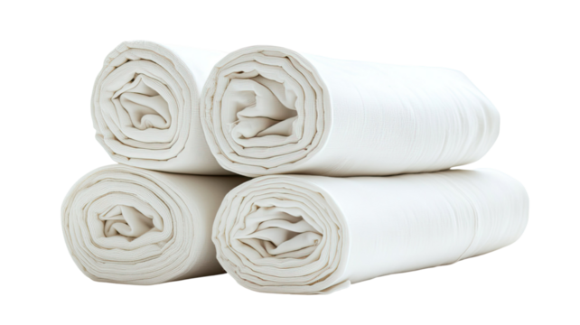 Stack of rolled white fabric with smooth clean textile layers neatly arranged soft material bundle cloth detail isolated on white background