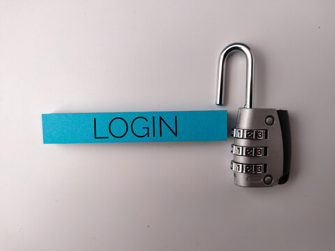 The image features a combination padlock next to a blue strip of paper with the word LOGIN written on it - Powered by Adobe