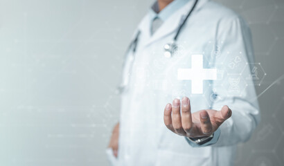 A doctor holding a glowing medical cross icon, representing modern healthcare technology and digital health systems in a professional clinical environment.
