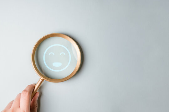 mental, health, support, therapy, awareness, anxiety, A magnifying glass highlighting a smiling icon symbolizing positive mental wellbeing and emotional awareness.