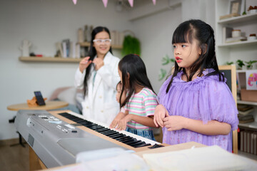 Children learning and playing piano happily in a bright living room, Teacher and girls engaging in music education with a keyboard and a smartphone