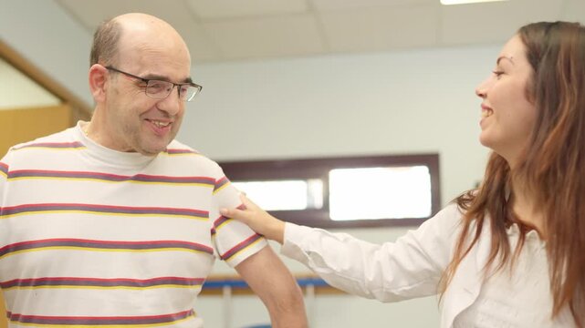 Person with physical disability in rehabilitation therapy
