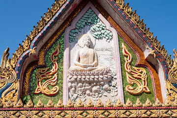 Buddhist sculpture detail thailand architectural art cultural heritage frontal perspective serenity