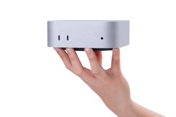 A hand holding a compact mini PC or portable computer isolated on a transparent background.