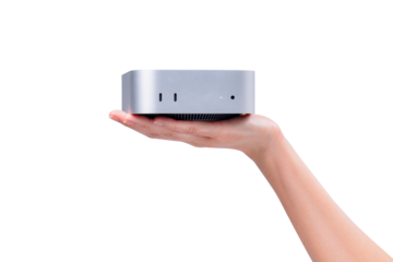 A hand holding a compact mini PC or portable computer isolated on a transparent background.