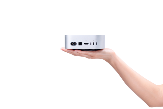 A hand holding a compact mini PC or portable computer isolated on a transparent background.