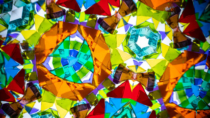 Vibrant macro photography of a natural kaleidoscope pattern, captured on camera. Bright, geometric abstract design with intense colors and light.