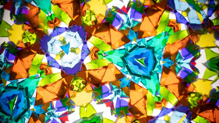 Vibrant macro photography of a natural kaleidoscope pattern, captured on camera. Bright, geometric abstract design with intense colors and light.