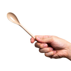 Male hand holding a brown plastic spoon isolated on white background.
