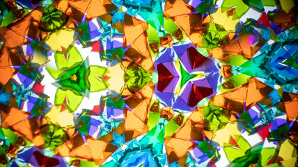 Vibrant macro photography of a natural kaleidoscope pattern, captured on camera. Bright, geometric abstract design with intense colors and light.