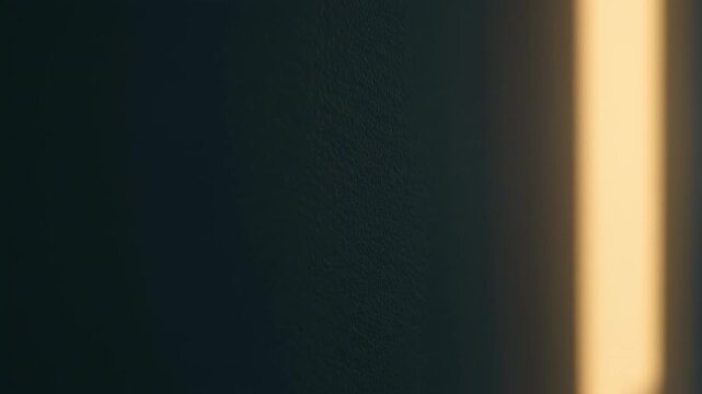 Light Beam on Textured Wall: Capturing the interplay of light and shadow, a luminous beam descends upon a textured wall.