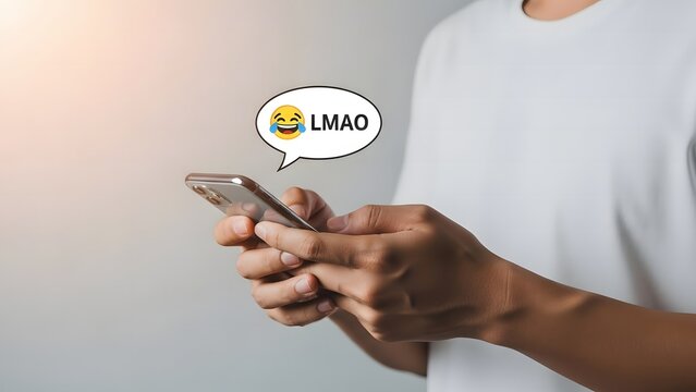 Person laughing out loud at something funny on their mobile phone