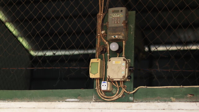 A prepaid electricity meter is installed on the wall.