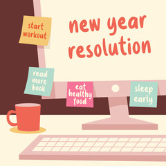 Computer at the desk with the new year resolution notes