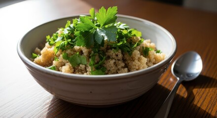 Healthy bowl of quinoa salad garnished with fresh parsley
