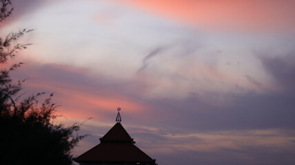 The roof of a mosque on the north coast of Tuban, East Java, looks magnificent and beautiful with the impressive sunset sky as a backdrop.