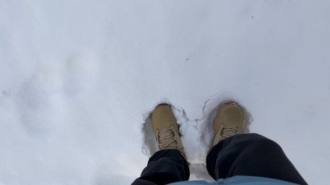 Stomping in Beige Winter Boots on Puffy Snow