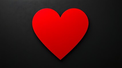 Minimalist red heart on dark textured background with directional lighting