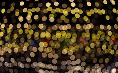 Golden bokeh light effect creating a warm and romantic atmosphere, perfect for festive or celebration background