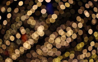 Golden bokeh light effect creating a warm and romantic atmosphere, perfect for festive or celebration background