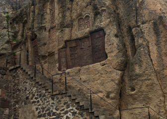 The wall with khachkars in the Geghard monastery