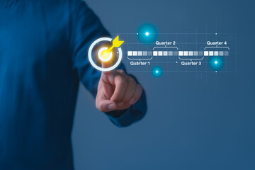 Business person touching a target icon on a digital quarterly timeline, symbolizing strategic planning, KPI goals, project milestones, performance tracking, and long term business objectives.
