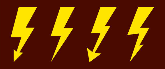 Four bright yellow lightning bolts on a dark background