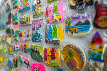 A collection of souvenirs bearing the names of popular tourist destinations in Bali