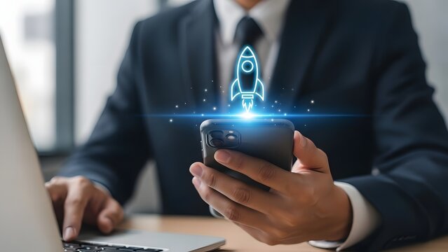 Businessman using smartphone with rocket launch icon for business growth - Powered by Adobe
