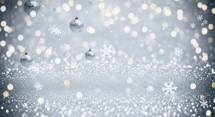 Christmas baubles and snowflakes falling against a silver background.