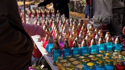Glass Votive Candle Lanterns Sold at Outdoor Market Stand by Christian Catholic Cemetery on All Saint Day