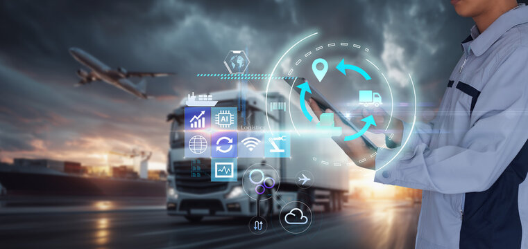 Smart Warehouse,Inventory management system concept.Manager using digital tablet,showing warehouse software management dashboard on blurred logistics as background