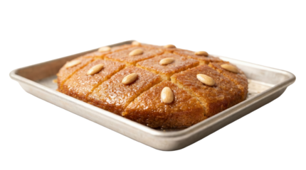 PNG cut out isolated background. A high-angle studio shot of a metal baking tray filled with Basbousa, also known as Namoura. The golden brown semolina cake is soaked in sweet syrup, cut into diamond 