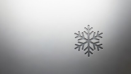 A metallic snowflake icon on a metallic background.